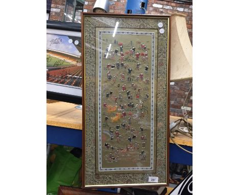 A FRAMED ORIENTAL TAPESTRY PANEL SIZE 67CM X 34CM 