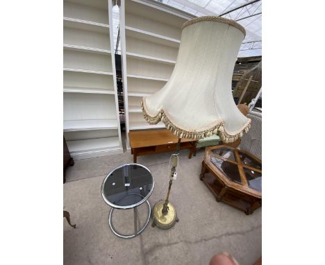 A TUBULAR CHROME OCCASIONAL TABLE, 18" DIAMETER, WITH SMOKED GLASS TOP AND BRASS/ONYX STANDARD LAMP ON CLAW FEET, COMPLETE WI