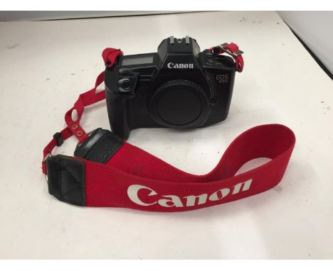 A CANON EOS 650 DIGITAL CAMERA WITH CANON STRAP 
