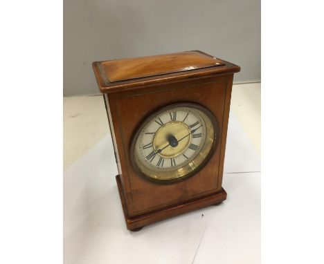 A LATE VICTORIAN FRUIT WOOD CASED HAC MANTLE CLOCK WITH ROMAN NUMERALS AND KEY SEEN WORKING BUT NO WARRANTY 
