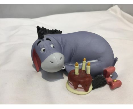 A POOH AND FRIENDS DISNEY CERAMIC FIGURE OF EEYORE ON HIS BIRTHDAY 