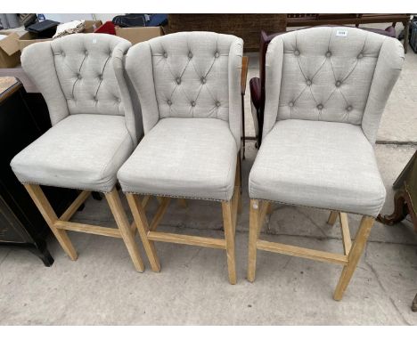 FOUR MODERN UPHOLSTERED KITCHEN STOOLS WITH WINGED AND BUTTON BACKS 