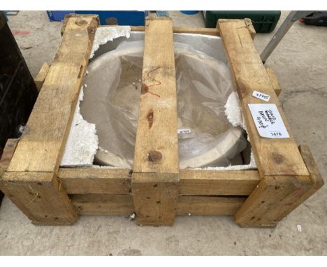 A CREAM WASH BASIN FORMED FROM A SOLID PIECE OF MARBLE 