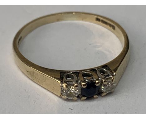 A 9 CARAT GOLD RING WITH A CENTRAL SAPPHIRE AND A DIAMOND EACH SIDE SIZE K/L IN A PRESENTATION BOX 