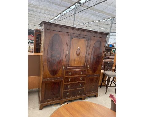 A VICTORIAN MAHOGANY WARDROBE WITH CENTRE DOOR, FOUR DRAWERS AND TWO OUTER DOORS 