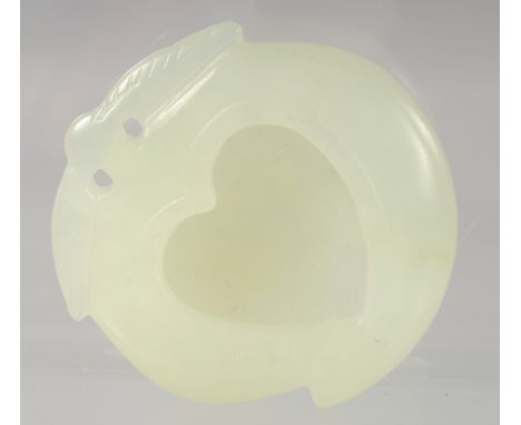 A SMALL CHINESE CARVED JADE HEART SHAPED BRUSH WASHER. 5cm diameter.