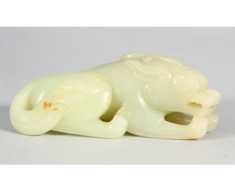 A CHINESE CARVED JADE CROUCHING LION. 9cm long.