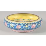 A 19TH CENTURY CHINESE CANTON ENAMEL BOWL, the interior decorated with a central panel depicting