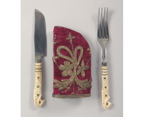 AN UNUSUAL EARLY 19TH CENTURY OTTOMAN KNIFE AND FORK SET, with inlaid bone handles and embroidered velvet scabbard.