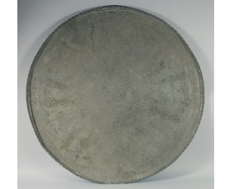 A VERY LARGE OTTOMAN ARMENIAN TINNED COPPER TRAY, with central inscribed panel, 89cm diameter.