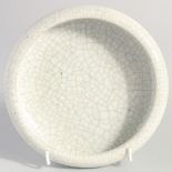 A CHINESE CRACKLE GLAZE CIRCULAR BRUSH WASH. 17.5cm diameter.