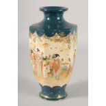 A JAPANESE SATSUMA HEXAGONAL VASE, painted with female figures, signed to base, 25cm high.