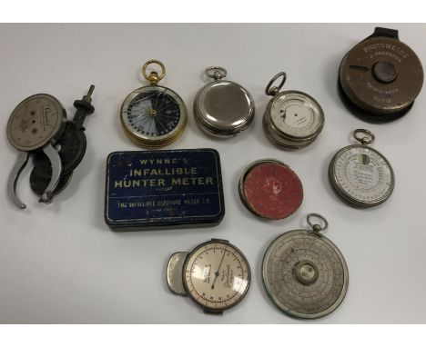 A collection of various small scientific instruments and measuring tools including a J Collark of Dresden pocket barometer wi