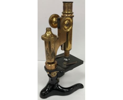 An early 20th Century lacquered brass and black lacquered monocular microscope by E Leitz of Wetzlar No'd 149811 27 cm high m
