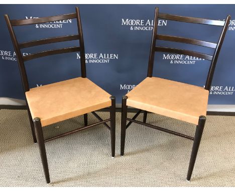 A set of four Swedish Gemla teak framed ladder back dining chairs with leather upholstered seats on turned legs united by str