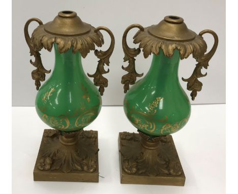 A pair of 19th Century green glass gilt decorated gas lamp bases of baluster form with metal mounts with twin handle metal mo