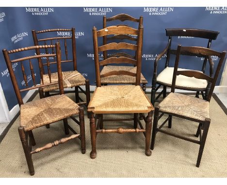 A pair of 19th Century beech and ash framed rush seat spindle back chairs, two 19th Century rush seat ladder back chairs and 