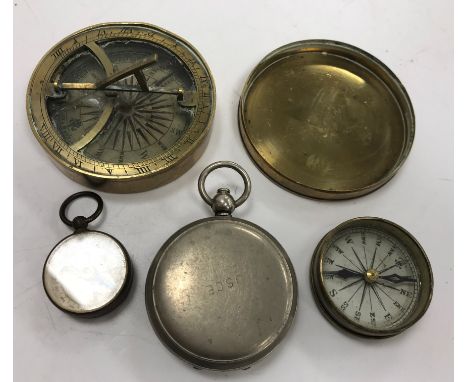 A Victorian brass cased compass 6.3 cm diameter together with two smaller brass cased compasses and a plated cased pocket wat