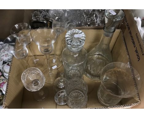 A collection of glassware to include decanters, a Laura Ashley home hurricane style lamp, various drinking glasses, a small c