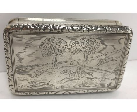 A George IV silver snuff box of rectangular waisted form, the top decorated with huntsmen and hounds by fence in a landscape 