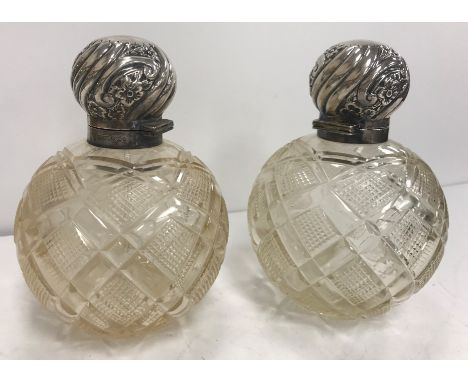 A pair of Edwardian hobnail cut glass grenade scent bottles with embossed silver mounts (by James Dixon &amp; Sons, Sheffield