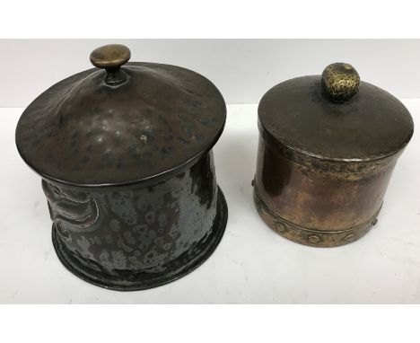 An Arts & Crafts copper circular tea caddy with lift off lid and embossed decoration 13.5 cm high x 13.5 cm diameter together