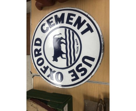 A vintage enamel sign inscribed "Use Oxford Cement" with cow trademark to centre and Barltrop Oxford 61 cm diameter 