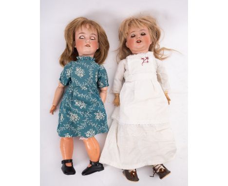 Two Armand Marseille bisque head dolls, both with applied wigs, blue glass sleeping eyes , open mouth with teeth ( one with t