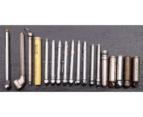 A collection of various nickel-plated tire pressure gauges, various makers including Dunlop and Michelin.