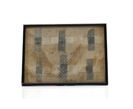 A needlework sampler, with six embroidered crosses in white and blue cotton, with initials and date 'PM 76', in a later eboni