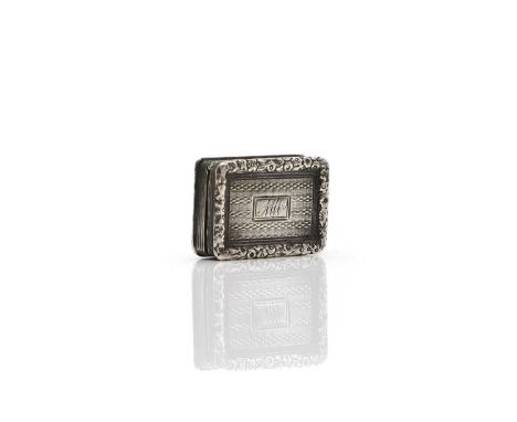 A George IV silver vinaigrette  by T S, Birmingham 1825, with pierced and gilt grille, the case with engine turned detail, 3c