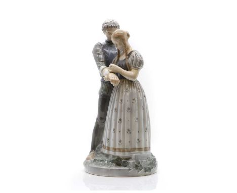 A Royal Copenhagen porcelain group, model no.3171, of a girl bandaging a young knight, printed and inscribed marks 'LP' and '