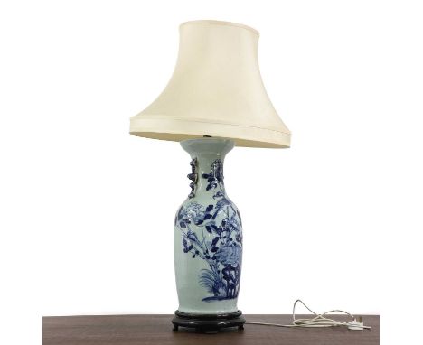 A Chinese blue and white vase, 19th century, converted to a table lamp, with birds and flowers, the neck with lions, on an eb