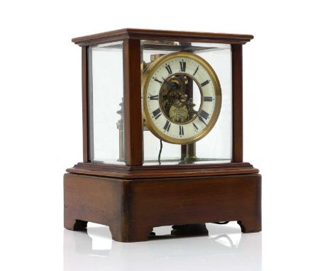 A Eureka electric mahogany mantel clock the enamel chapter ring with Roman numerals enclosing a skeleton centre the brass spe