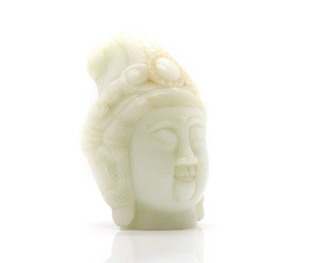 A Chinese jade carving, 20th century, of the head of Guanyin, 22.5cm highCondition ReportMinute chips to edges.