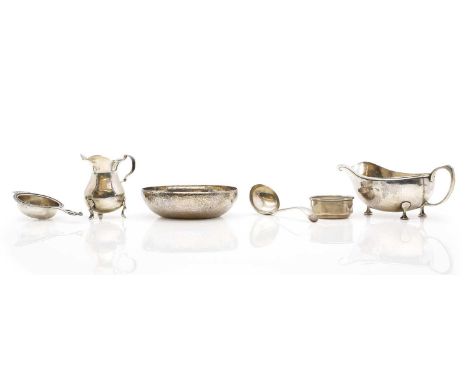A collection of silver items, comprising a George V sauceboat, by Albert Edward Jones, Birmingham, 1928, an Elizabeth II tea 
