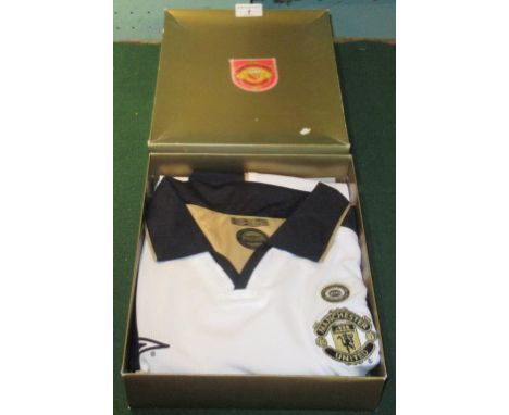 A Manchester United commemorative shirt, relating to 100 years of Manchester United 1902 - 2002 (boxed), together with associ