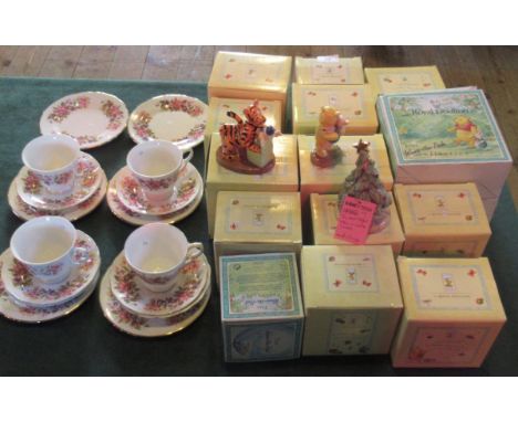 A collection of Royal Doulton Winnie the Pooh figurines, together with a Colclough part-tea service.