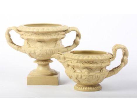 A Ridgways drab ware sucrier shaped as the Warwick vase and a matching milk jug