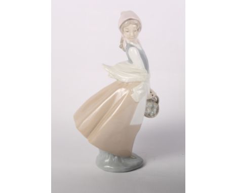 Three Lladro porcelain models of geese and two other larger figures of a lady and pigeons and a Nao figure of a lady