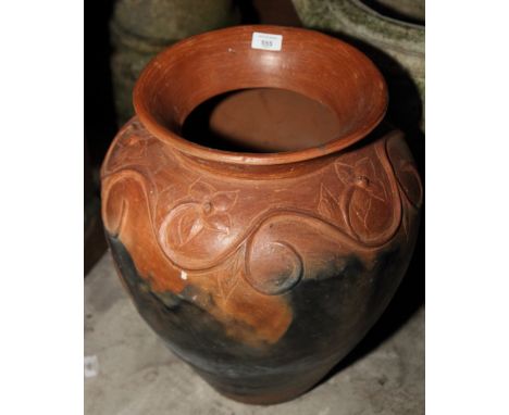 An Indonesian blue glazed ceramic garden urn, 27" high, and a similar terracotta urn