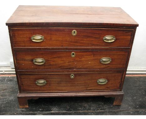 A Georgian mahogany chest of three long graduated drawers with oval brass plates, on bracket supports