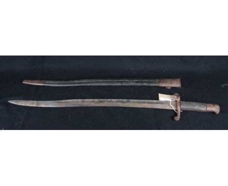 An early 20th Century French bayonet with recurved blade, chequered grip and scabbard, 28" long