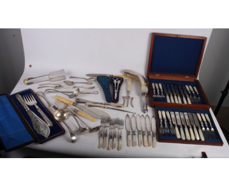A Victorian mop-handled fruit set for twelve, in wooden case, a cased pair of grape scissors, a cased set of fish servers, a 
