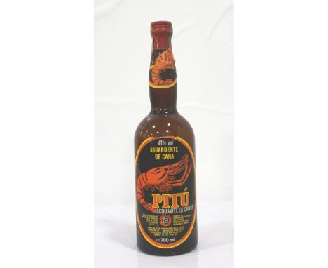 PITU AGUARDENTE DE CANA A very rare example of the very first bottle exported to Europe of the  Pitu Aguardente de Cana spiri