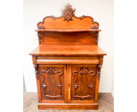 Victorian mahogany chiffonier with decorative shelf back with drawer and fielded panel doors under. 41" wide 