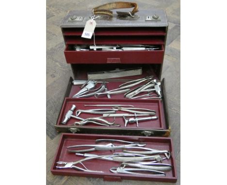 Large selection of dental tools in a brown leather carrying case complete with three graduated drawers 