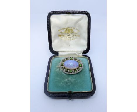 French turn of the century opal emerald and diamond brooch, set with a large oval opal measuring 1.5cm long, closed back yell