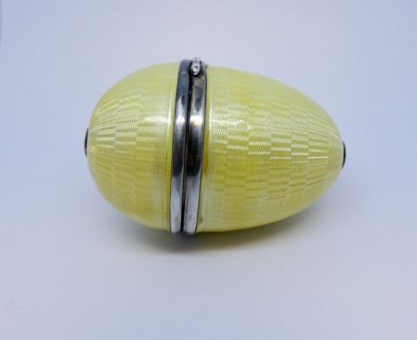 Asprey - lemon yellow enamel egg shaped silver sewing etui. Marked makers marks and hallmarks.     Bruise to the enamel on ba