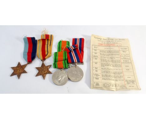 A group of 4 medals comprising the 1939/45 Star, Africa Star, defence and war medals together with paperwork and the original